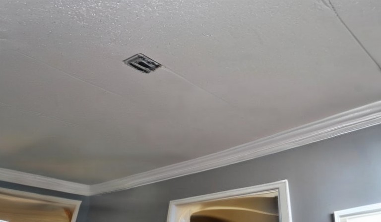 The Pros and Cons of Painting Over a Popcorn Ceiling