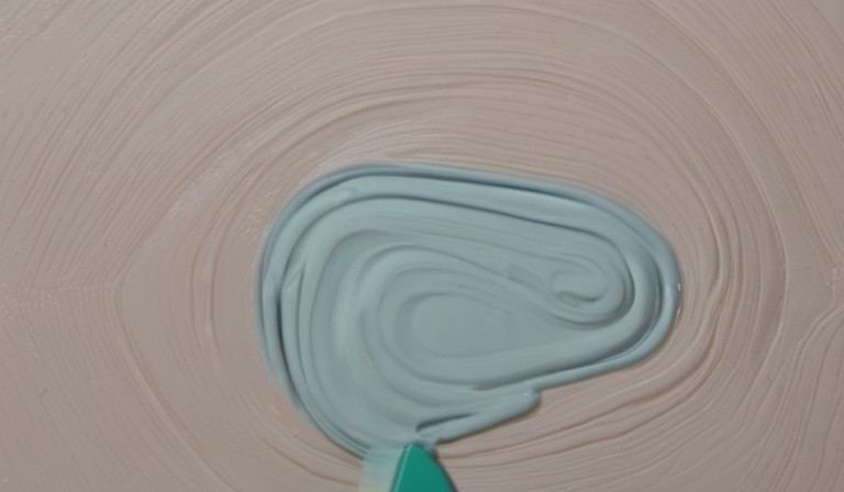 Is it possible to apply latex paint over an oil-based primer?